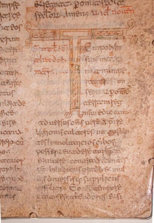 Leaf from a very large copy of the Acta Sanctorum, with a monumental decorated initial ‘T’, in Beneventan minuscule, in Latin, decorated manuscript on parchment.