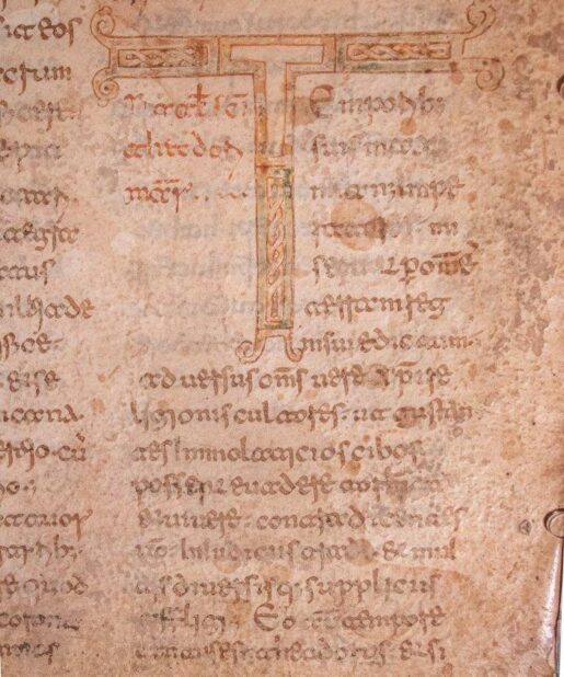 Leaf from a very large copy of the Acta Sanctorum, with a monumental decorated initial ‘T’, in Beneventan minuscule, in Latin, decorated manuscript on parchment.